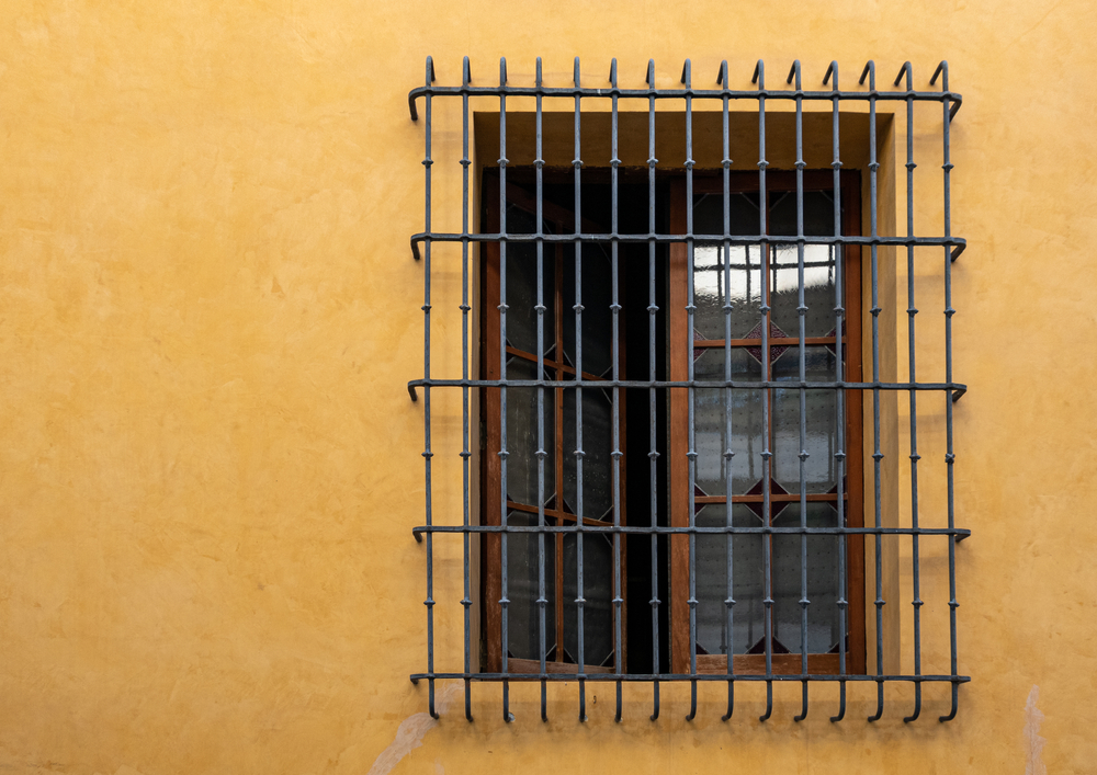 Large,Window,With,Traditional,Iron,Grille.